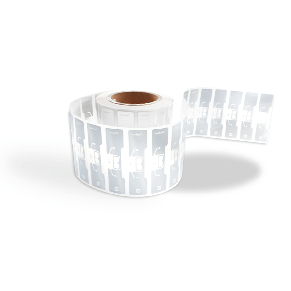 A full roll of AD Dogbone RFID Labels featuring clear PET substrate and Impinj M730 chip.